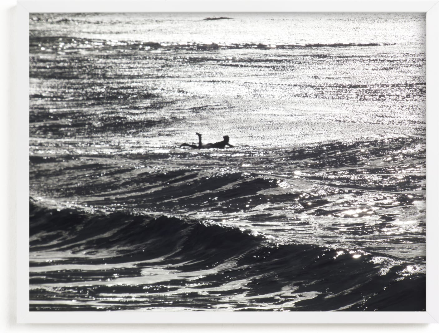 This is a black and white art by Annie Seaton called Cayucos Pier Surfer, Winter Morning Sun.