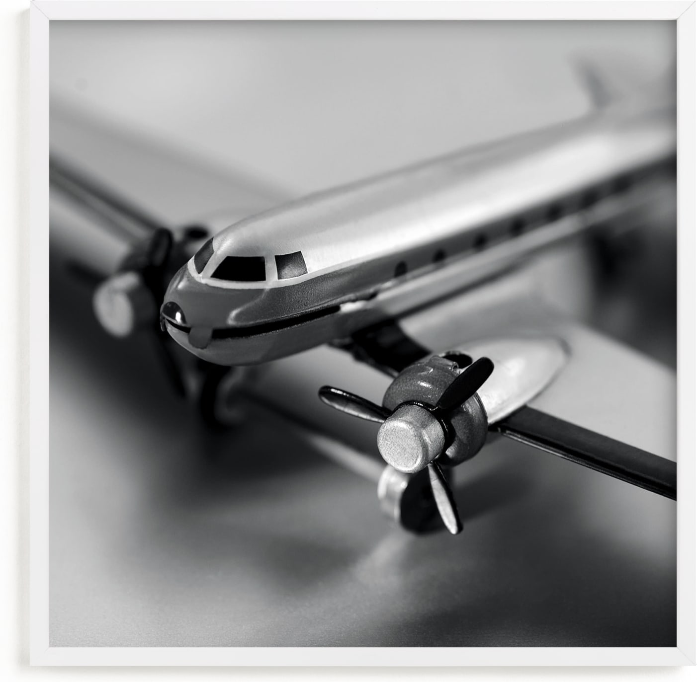 This is a black and white kids wall art by Laura Hamm called Retro Airplane.