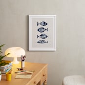 "Linocut Fishes" - Art Print in Navy Blue by Alisa Galitsyna - In a Room