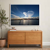 "The late surfer " - Art Print in sunset-blue by NSMARK - In a Room